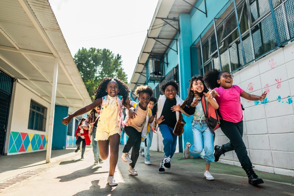 Students running on schoolyard