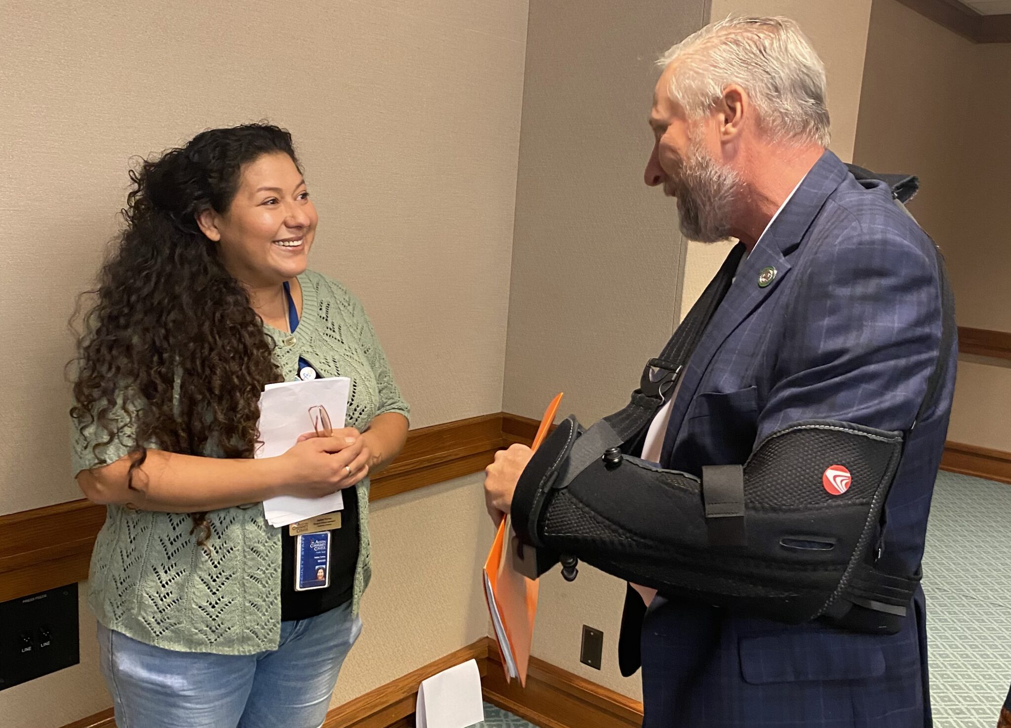 Student Parent Isabel Torres talks with a lawmaker about student parent issues.